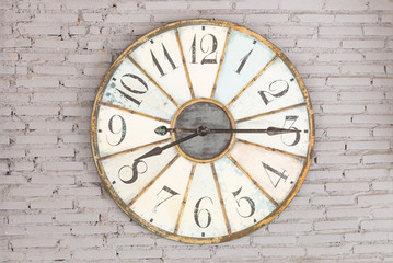 Retro clock showing eight fifteen on the wall
