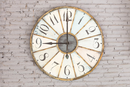 Retro Clock Showing Nine Oclock On The Wall