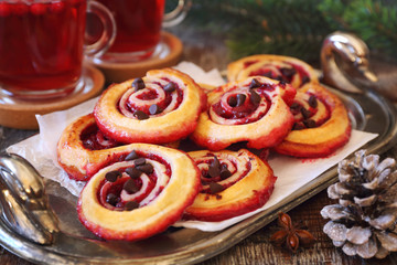  Sweet cranberry roll buns and two cups of cranberry fruit drink