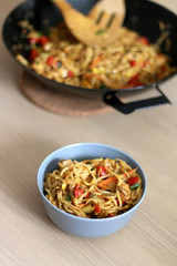 Stir fry noodles with chicken and vegetables. Selective focus. 