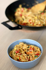 Stir fry noodles with chicken and vegetables. Selective focus. 