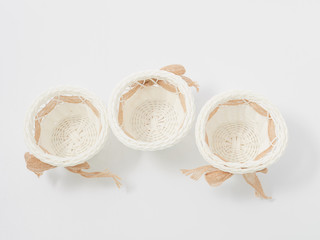 check miniature baskets of vines on a white background