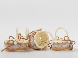 check miniature baskets of vines on a white background