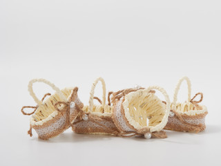 check miniature baskets of vines on a white background