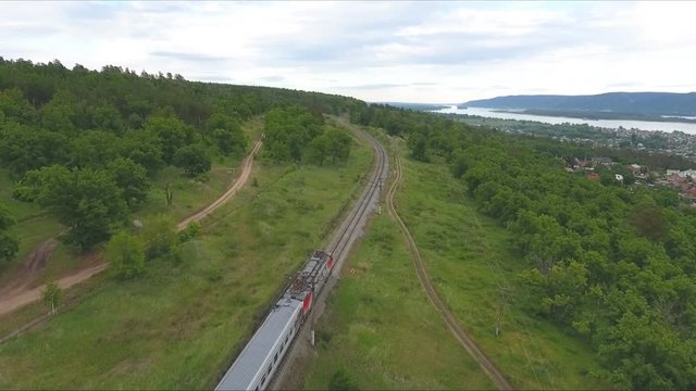 Train Going by Railway Against Summer Landscape
