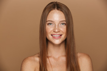 Beauty portrait of a smiling young topless woman