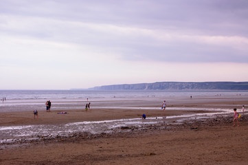 beach scene with tide out few people