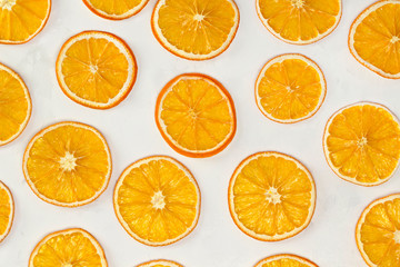 Obraz premium Dried oranges background. Christmas, New Year, recipe, culinary concept. Top view, flat lay, close-up