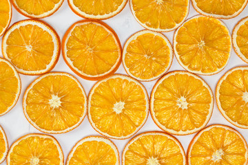 Dried oranges background. Christmas, New Year, recipe, culinary concept. Top view, flat lay, close-up