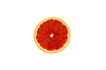 Top view of a red grapefruit slice on a white background. Healthy diet, tropical fruit.