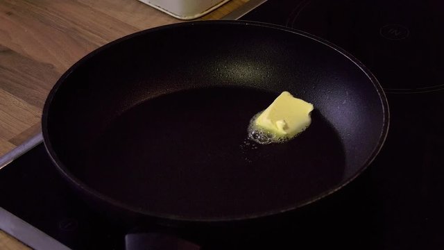 Butter is melted in a hot pan