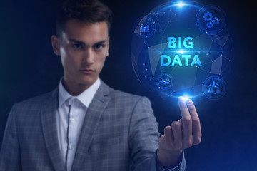 The concept of business, technology, the Internet and the network. A young entrepreneur working on a virtual screen of the future and sees the inscription: Big data