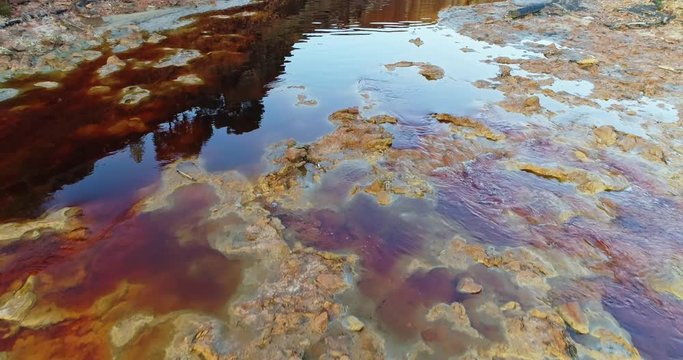 Rio Tinto river at Nerva besides the Rio Tinto mines. This river is very polluted and acid because of the extraction of tons of copper, zinc, gold, silver,lead and other metals since year 3000 BC to