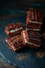 homemade chocolate brownies on dark background