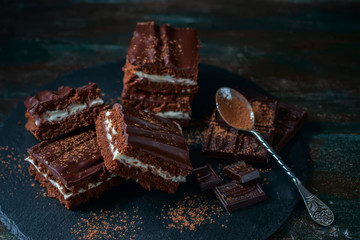 homemade chocolate brownies on dark background