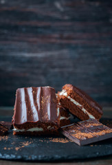 homemade chocolate brownies on dark background