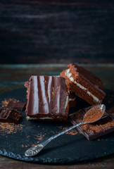 homemade chocolate brownies on dark background
