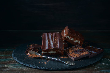 homemade chocolate brownies on dark background