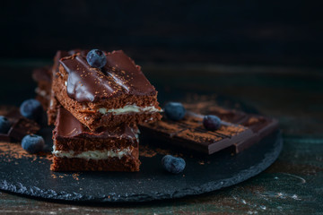 homemade chocolate brownies on dark background
