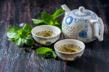 Chinese tea set, green tea and fresh mint.