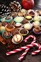a lot of variety chocolate pralines, belgian confectionery gourmet chocolate and christmas spices with apples