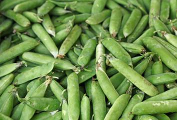 Close up green peas pods on retail display
