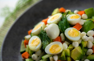 Fresh vegetable salad with quail eggs