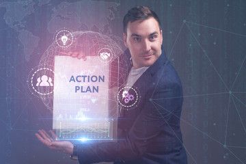 The concept of business, technology, the Internet and the network. A young entrepreneur working on a virtual screen of the future and sees the inscription: action plan
