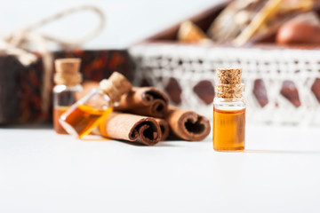 Essential oil cinnamon in glass bottle. Spa concept