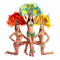 Brazilian women dancing samba over white background