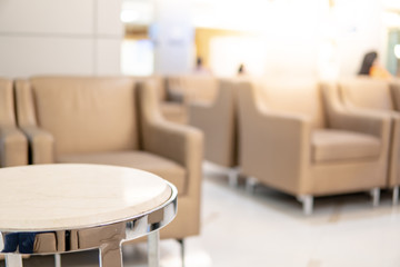 Table and sofa in waiting area of luxury hospital or hotel. Clinic interior background. Healthcare...