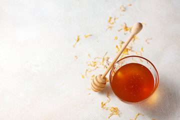 Natural honey with a wooden spoon.