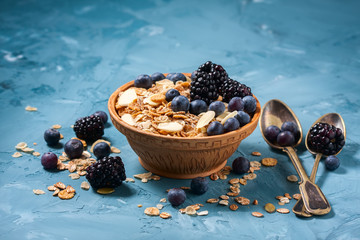 Granola with blueberries and blackberries. Healthy food.