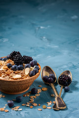 Granola with blueberries and blackberries. Healthy food.