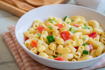 Macaroni salad with elbow pasta and vegetables in bowl