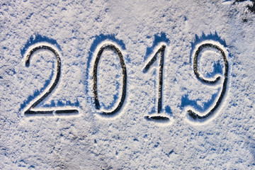 The inscription 2019 in the fresh snow. Coming new year