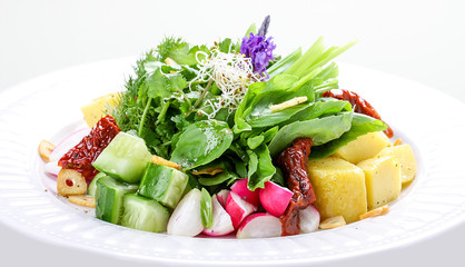 Salad with potatoes, radish and dried tomatoes