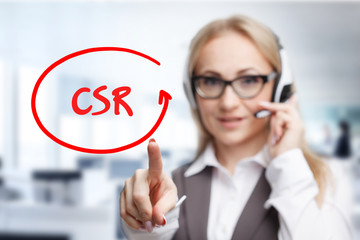 Technology, internet, business and marketing. Young business woman writing word: CSR
