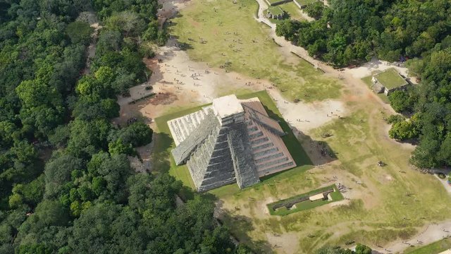 Aerial view of ancient Mayan city of Chichen Itza, famous mesoamerican pyramid El Castillo (Temple of Kukulkan) - landscape panorama of Yucatan Peninsula from above, Mexico, North America, 4k UHD