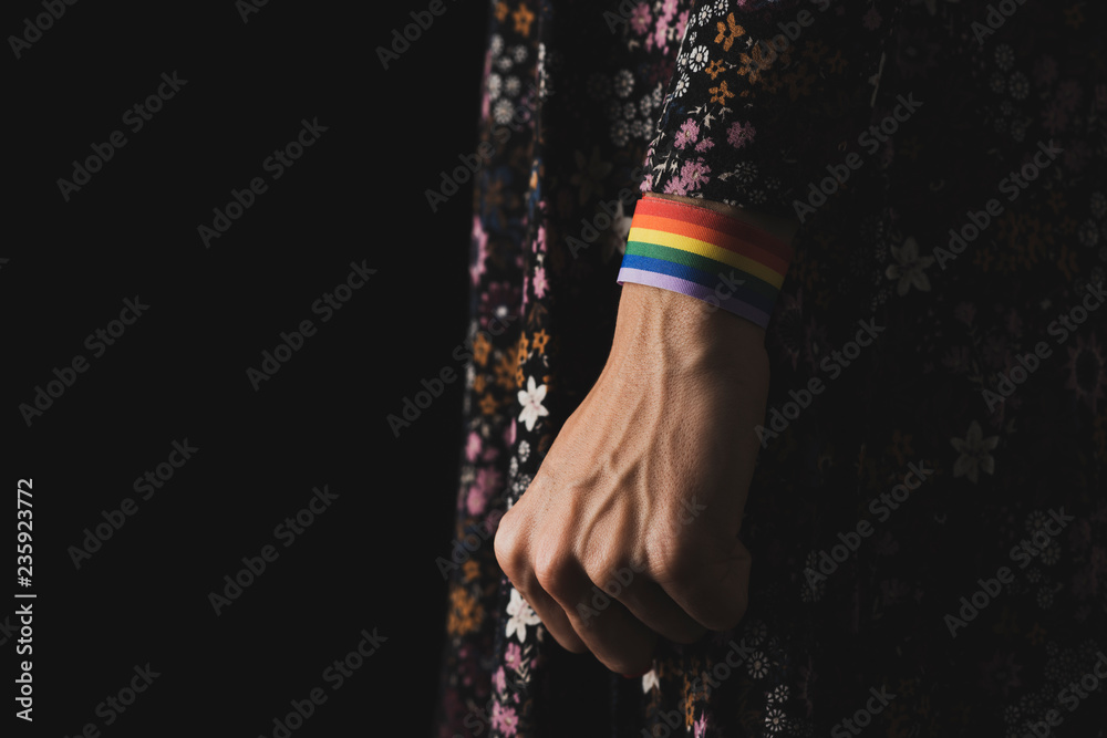 Sticker woman with a rainbow-patterned ribbon in his wrist