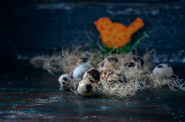 Easter composition, Quail eggs on the old wooden background.