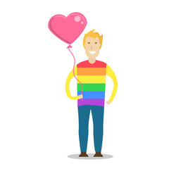 Young men wearing a rainbow t shirt and holding a heart shape balloon.