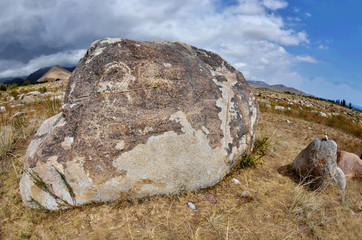Neolithic petroglyphs (rock paintings) depicting fighting of two mountain goats,Issyk-Kul lake, Kyrgyzstan,Central Asia