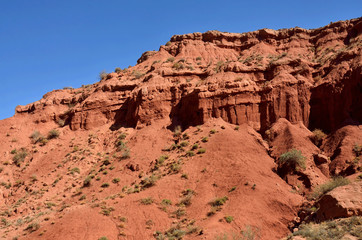 Red sandstone rocks of Konorchek canyon,Kirgyzstan,Central Asia, famous trekking place