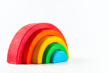 Rainbow, multicolored wooden eco toy. Isolated on white