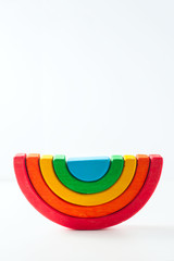 Rainbow, multicolored wooden eco toy. Isolated on white