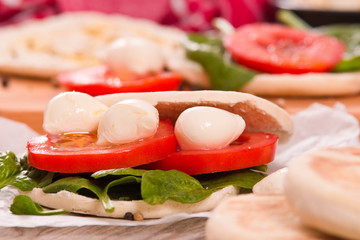 Tigella bread with spinach and tomatoes. 