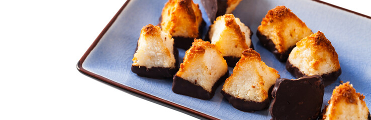 Golden Coconut Pyramids Cookies Isolated on White Background. Selective focus.