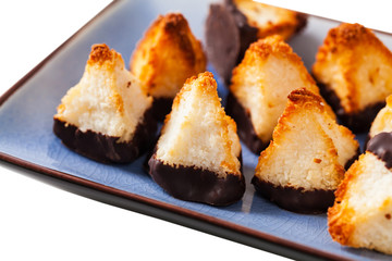 Golden Coconut Pyramids Cookies Isolated on White Background. Selective focus.