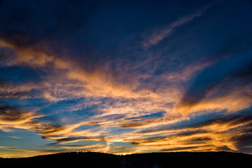 Dramatic blue sunset sky with pink clouds